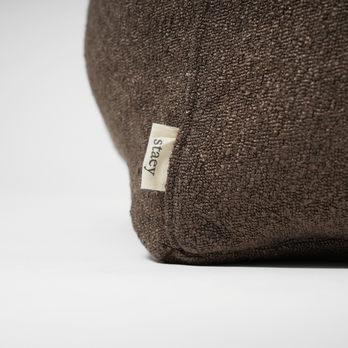 Close-up of the Staey label on the espresso dog bed
