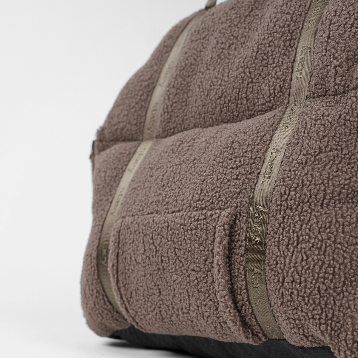 Close-up of the zip and non-slip base on the Clara teddy car seat