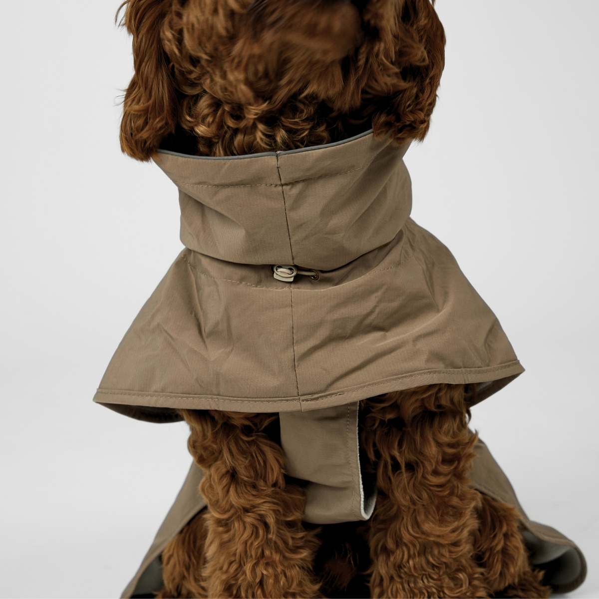 Close-up of the high collar on the taupe Clara rain coat