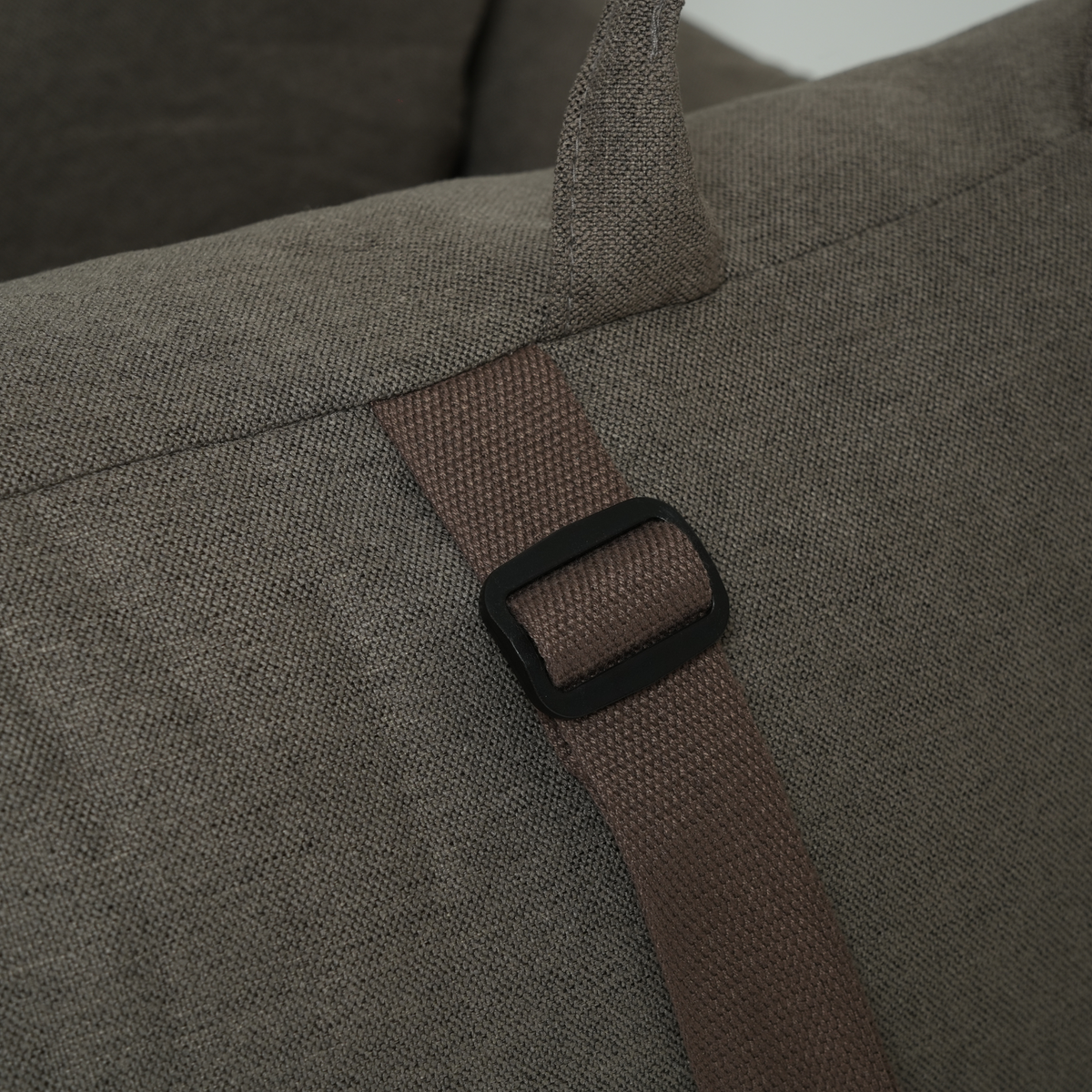 Close-up of the adjustable strap on the taupe corduroy dog car seat