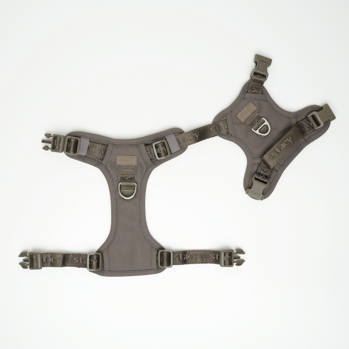 The taupe Elma harness laid flat, showing its buckles