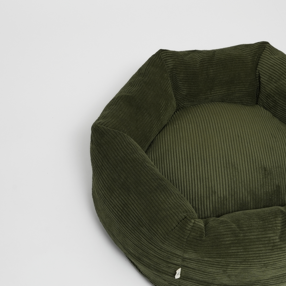 The moss green corduroy dog bed seen from above