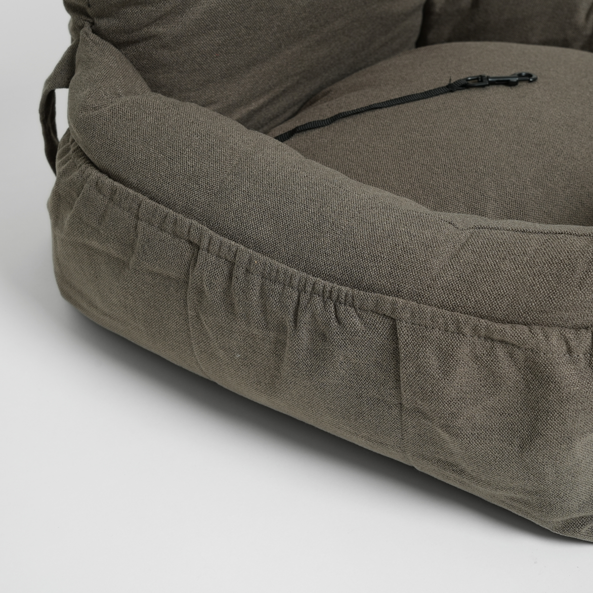 Moss green corduroy dog car seat seen from the side