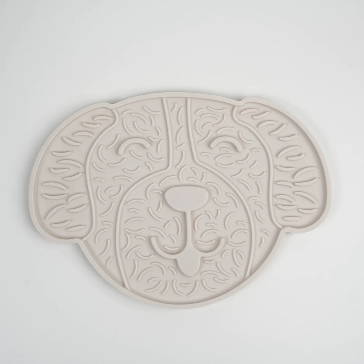 Cream licking mat shaped like a dog's face