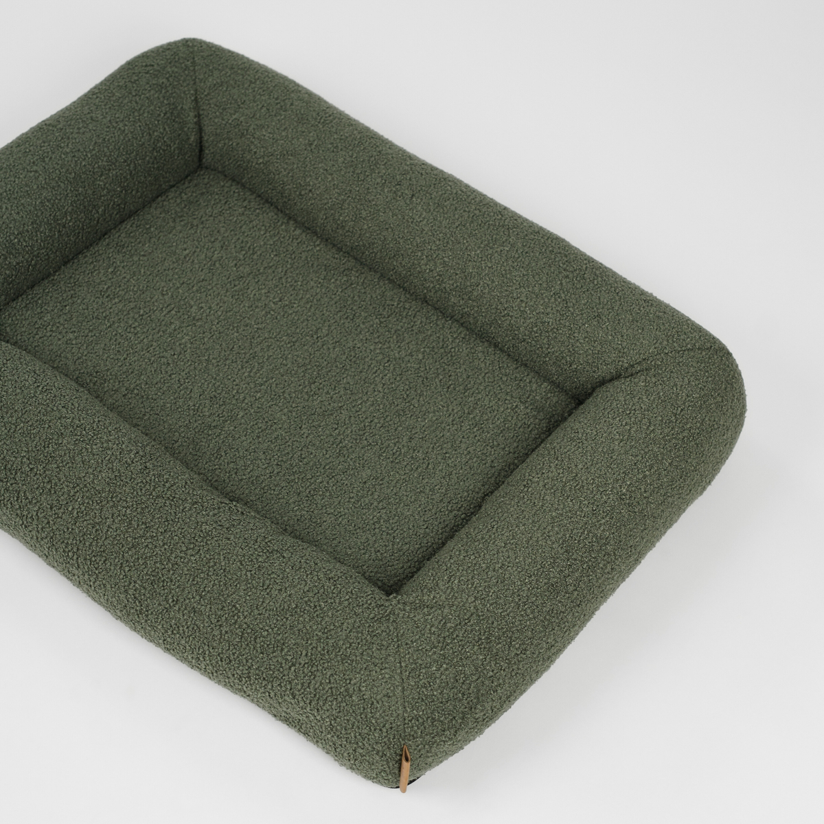 The moss green bouclé dog bed seen from above