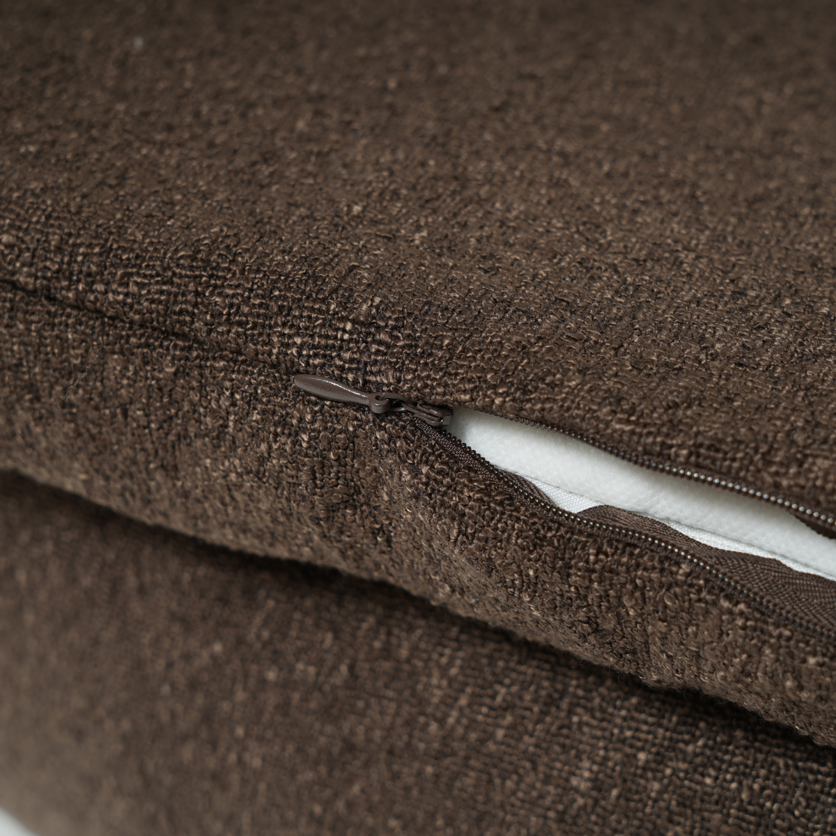 Close-up of the zip on the removable cover of the espresso dog bed