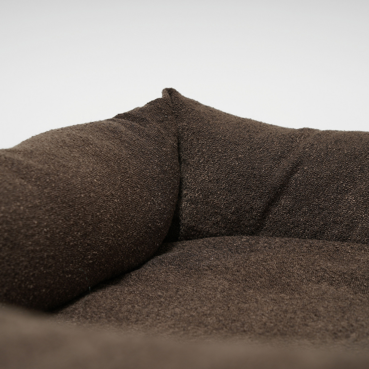 Close-up of the bolster and cushion inside the espresso dog bed
