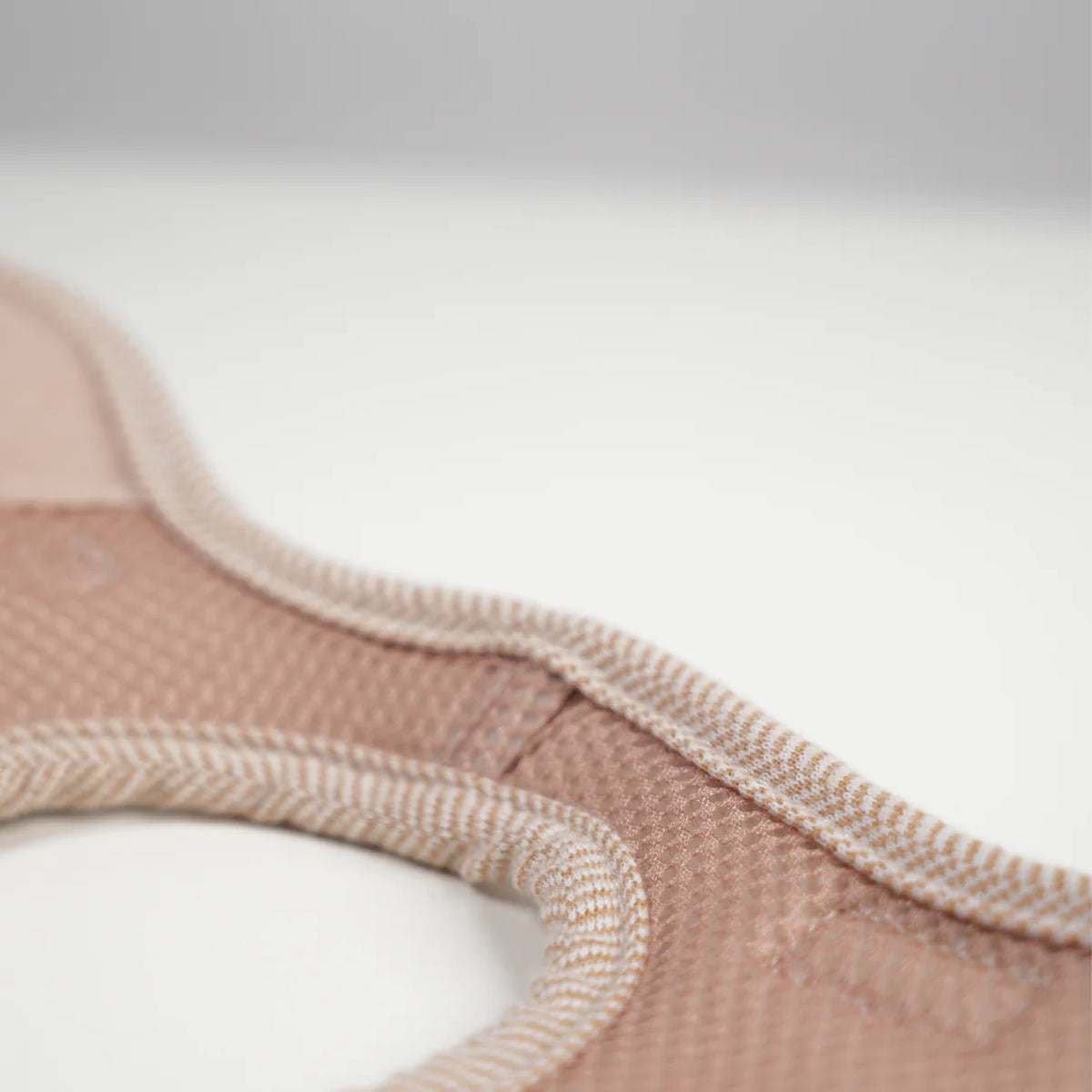 The light rose Saga step-in harness laid flat