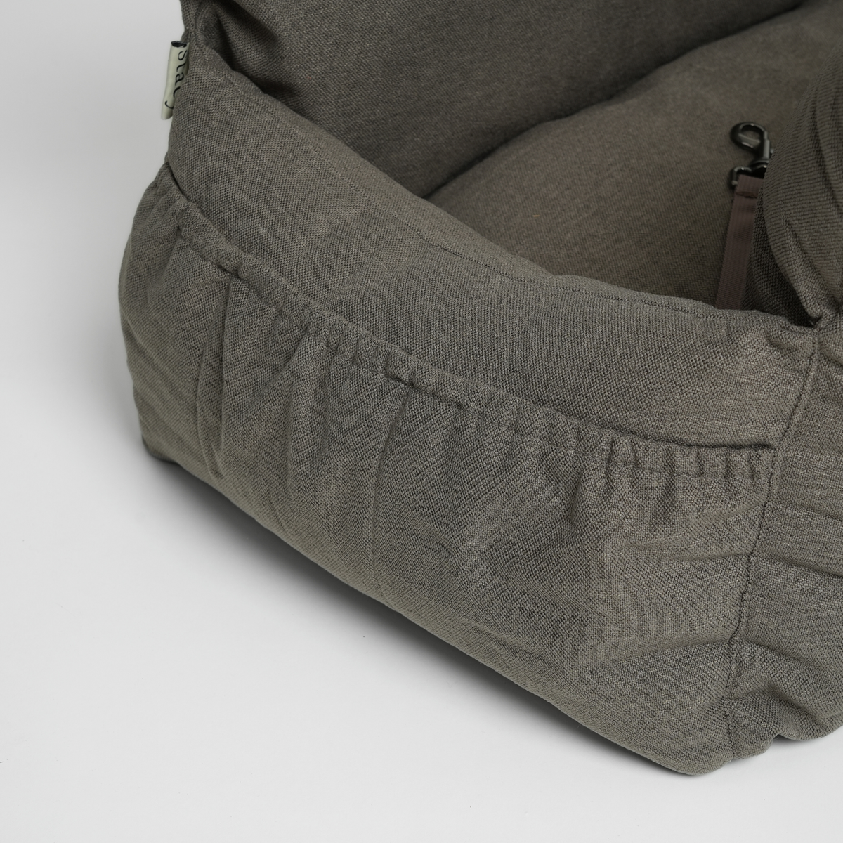 Close-up of the front pocket on the taupe corduroy XXL dog car seat