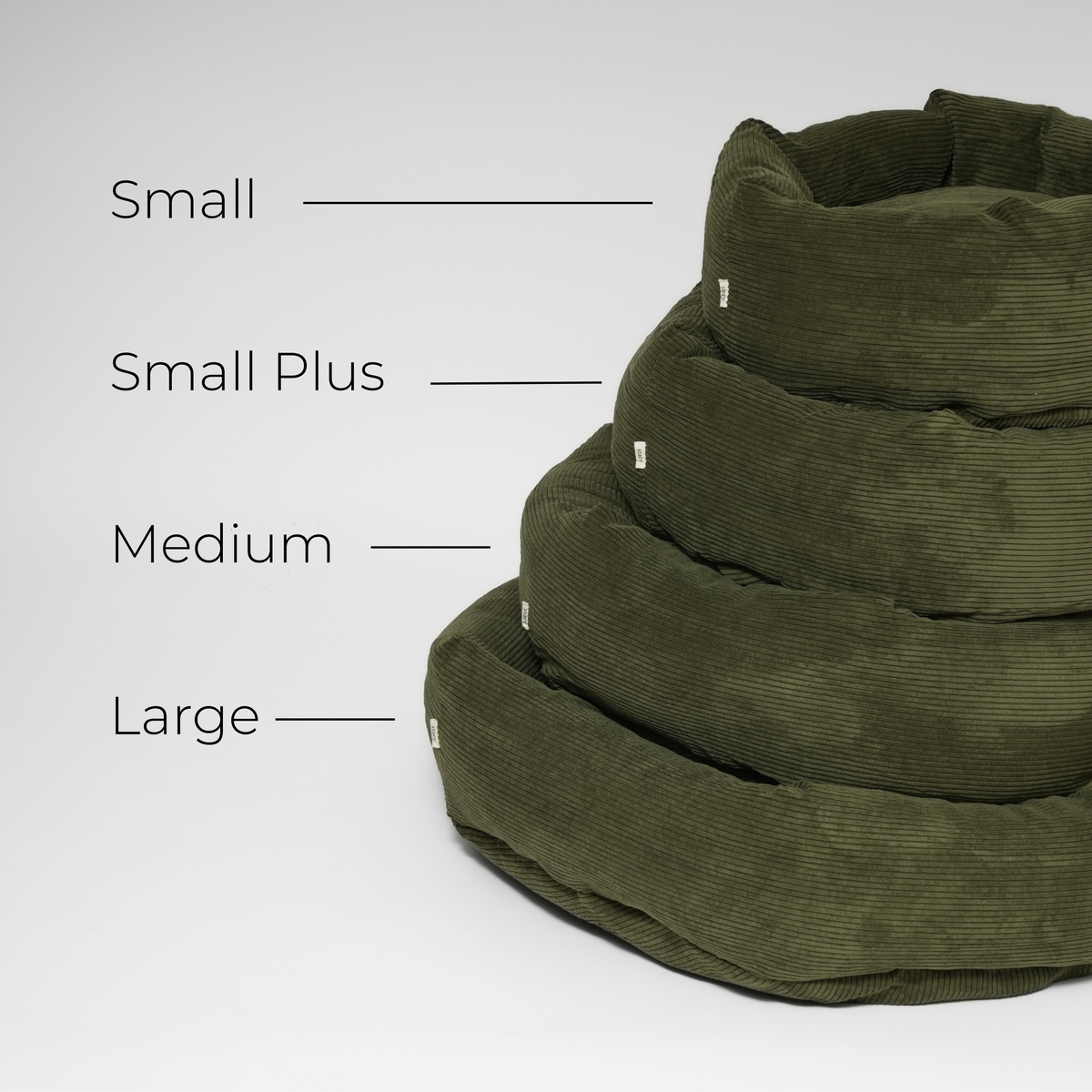 Size guide showing the moss green corduroy dog bed in Small, Small Plus, Medium and Large, stacked
