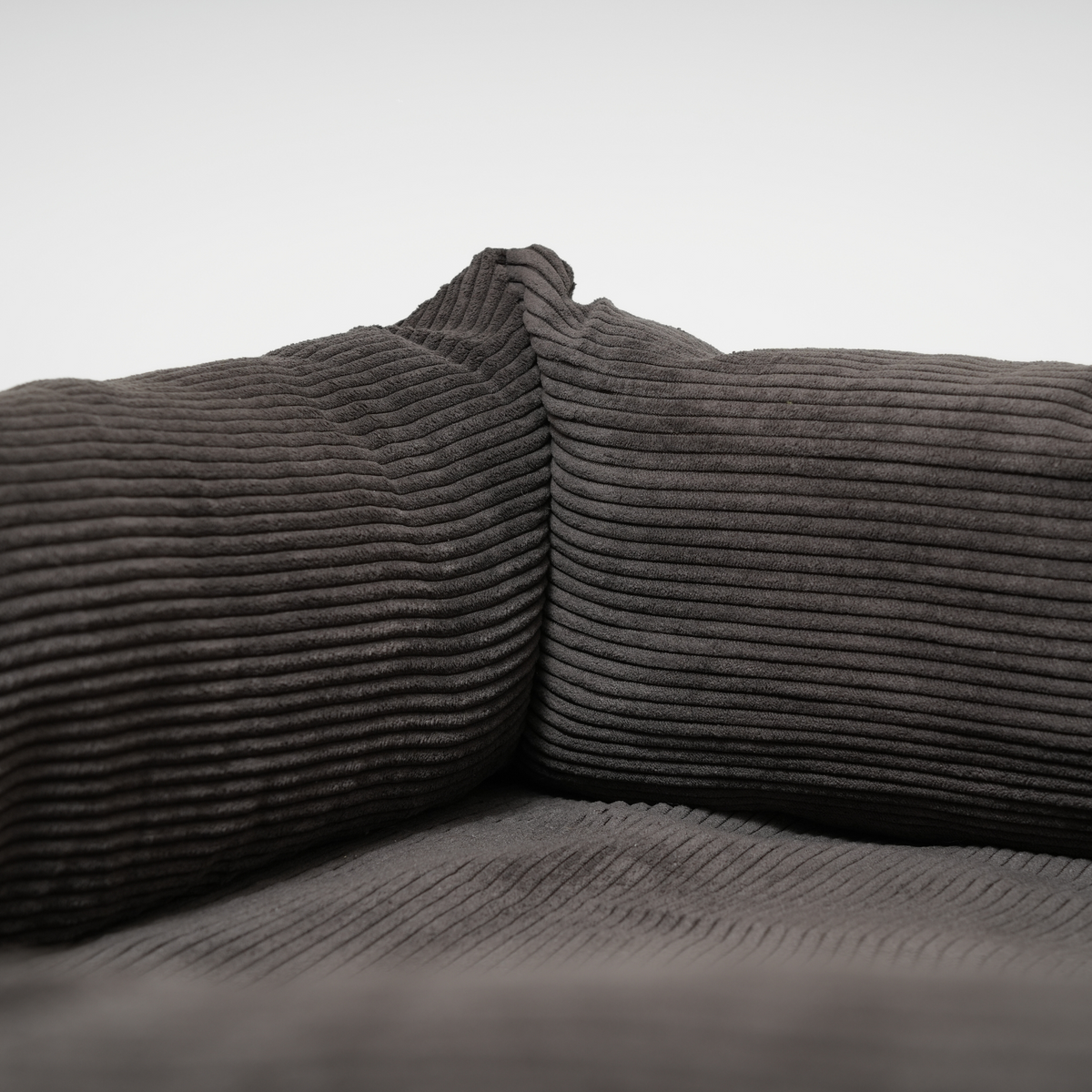 Close-up of the corduroy bolster inside the charcoal dog bed