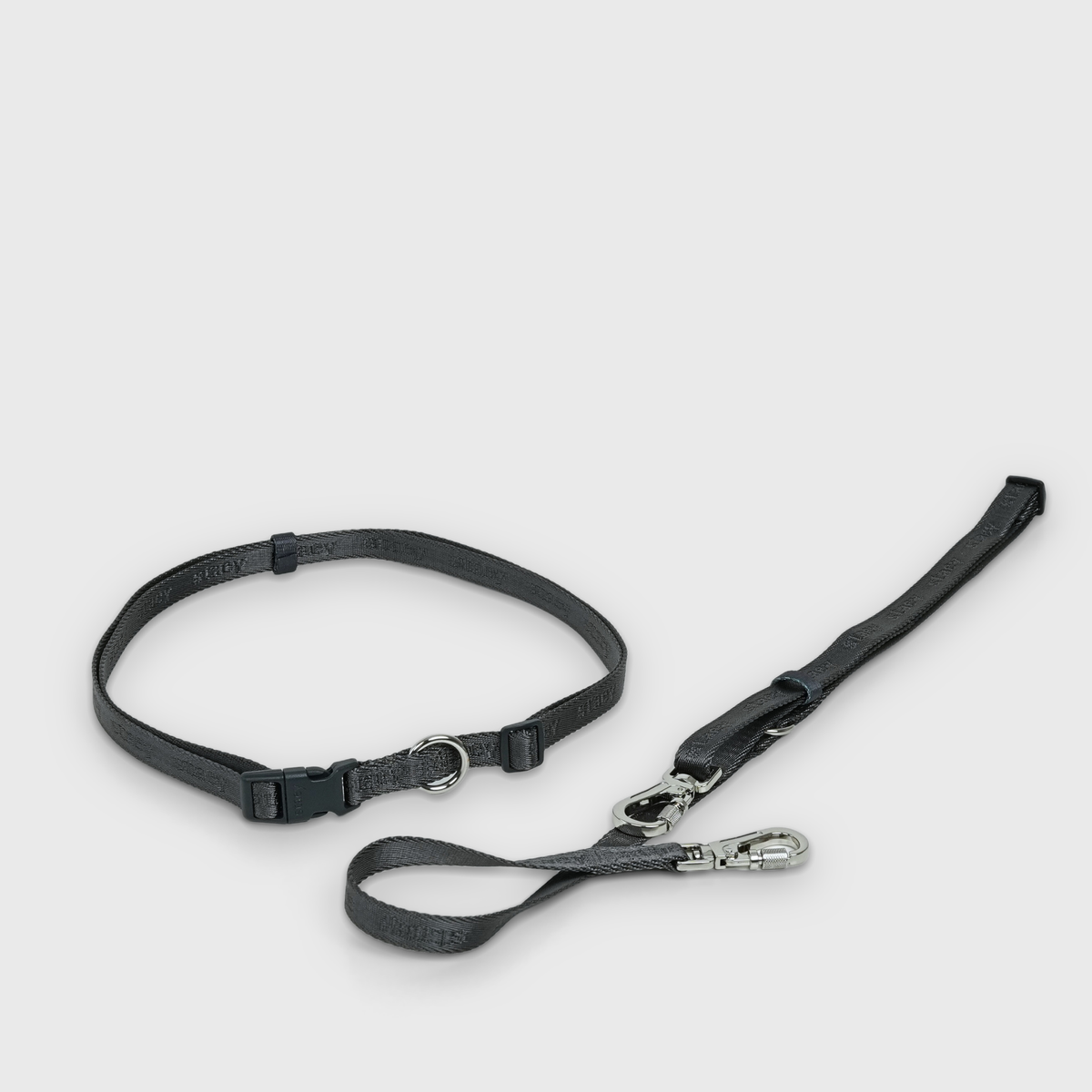 The dusty blue hands-free leash laid out with its snap hooks