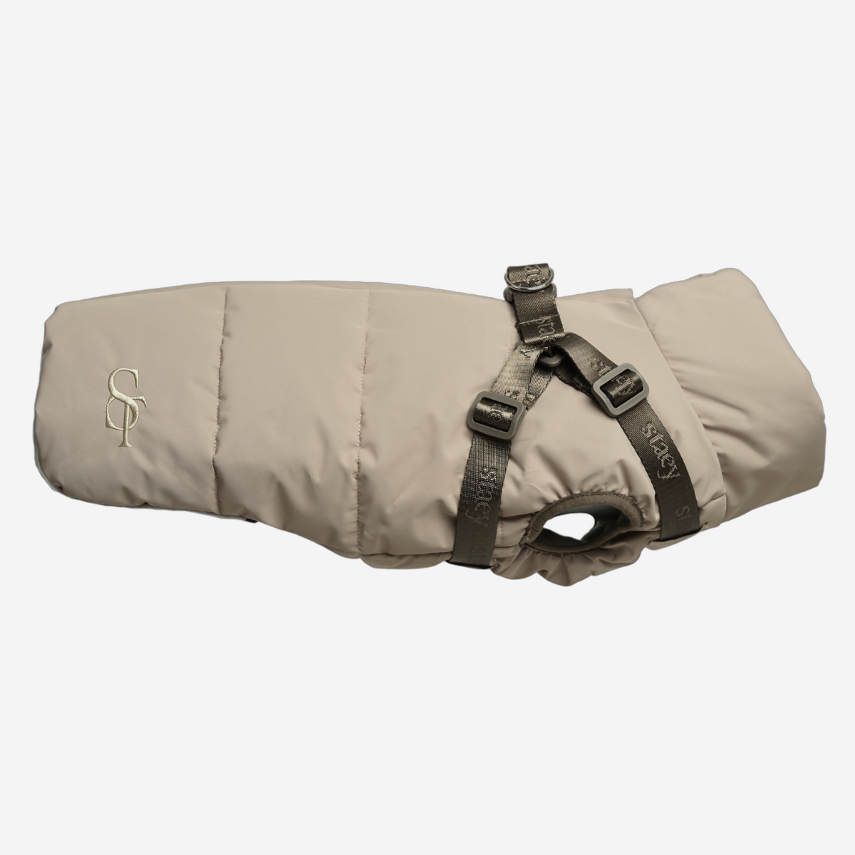 Vera quilted dog coat in sand with a built-in harness, side view